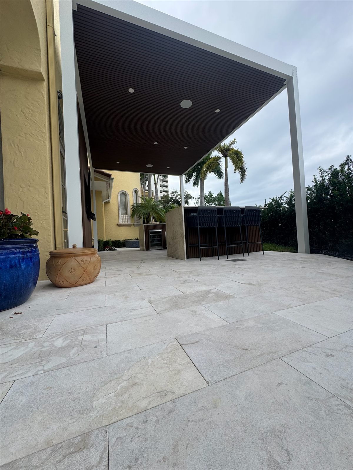 Open patio beneath the angled fluted ceiling