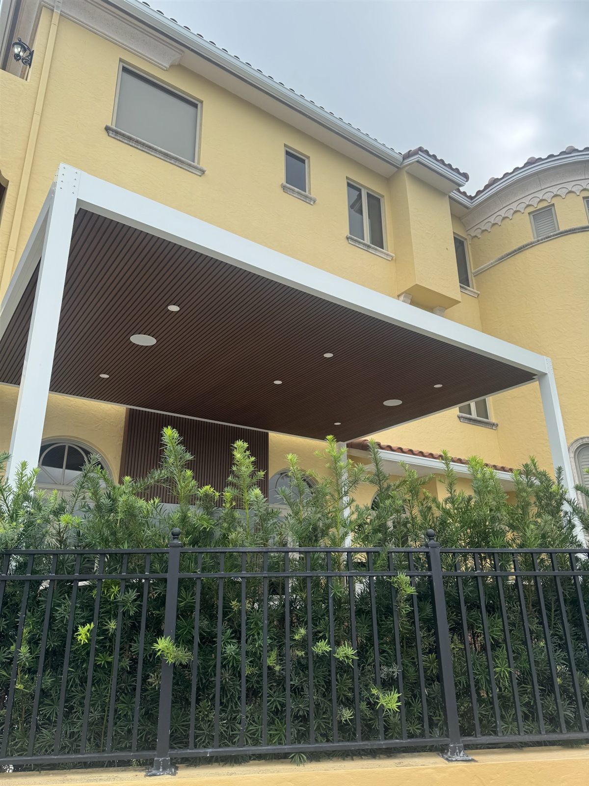 Exterior view of the white-frame PVC pergola