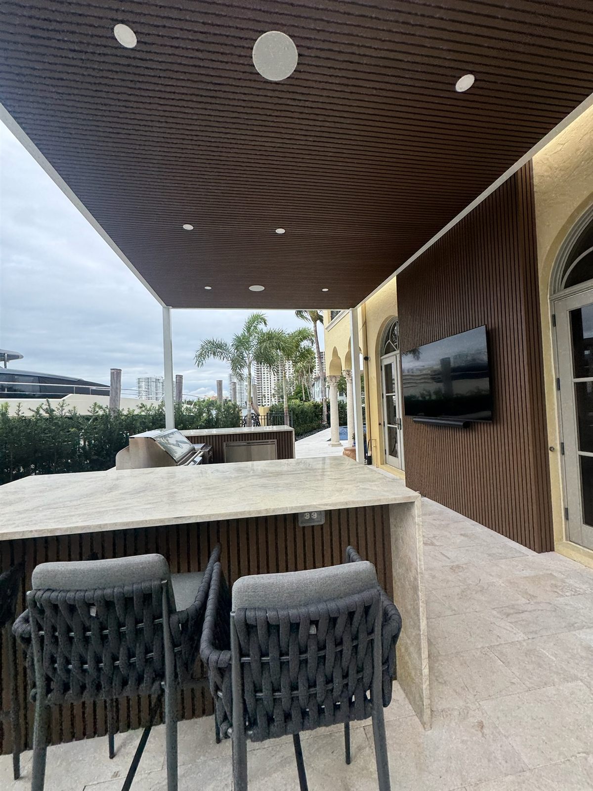 Bar stools beneath recessed lighting